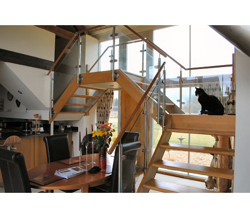 Hard wood stairs with glass balustrade